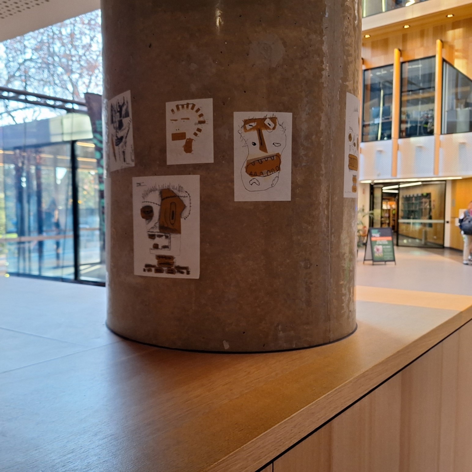 student drawings on a pillar