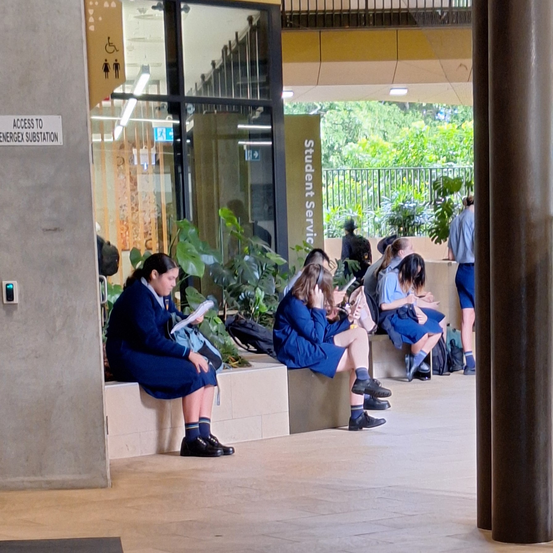 students sitting outside